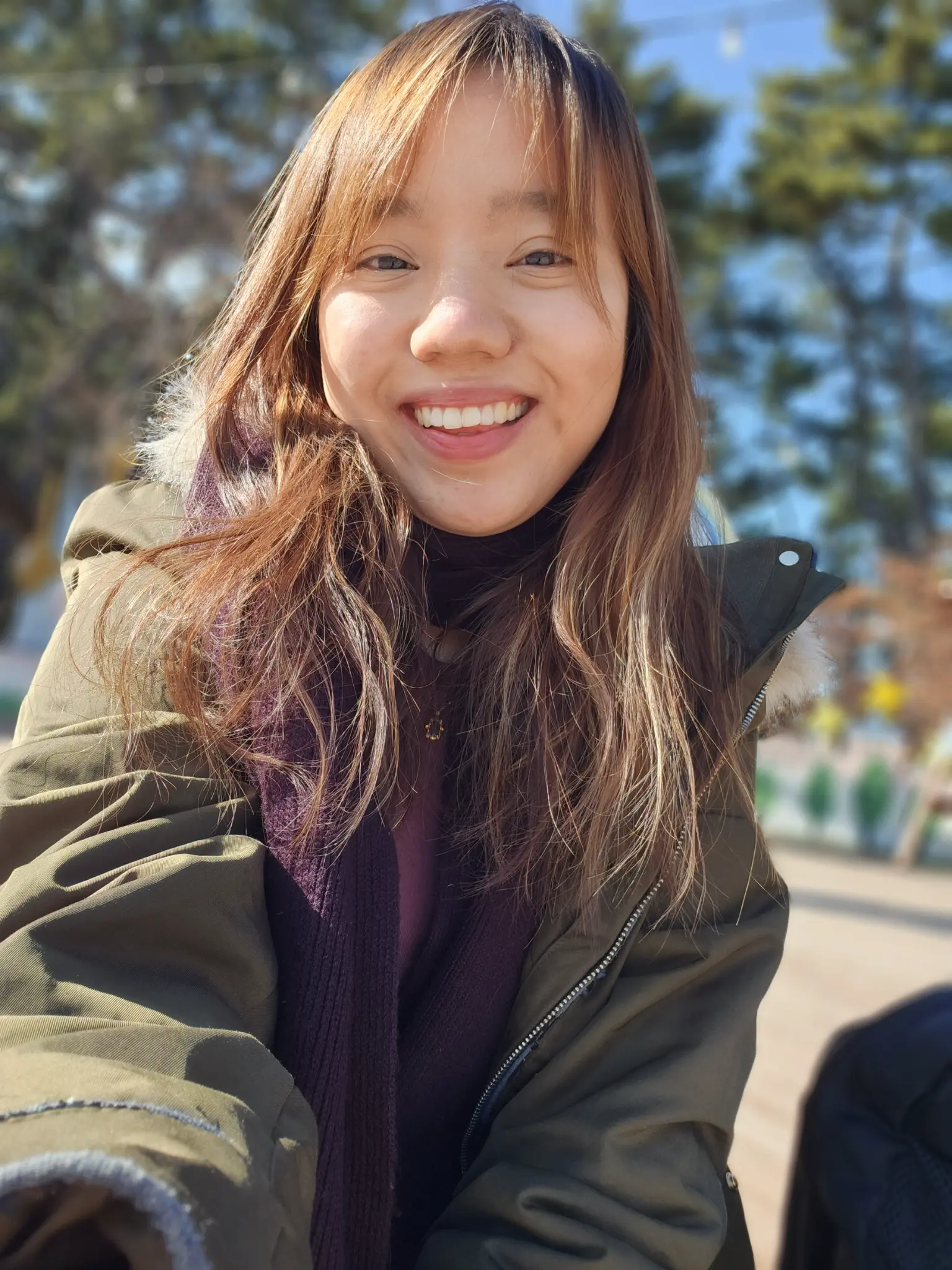 Portrait of Claudia Tan smiling outdoors